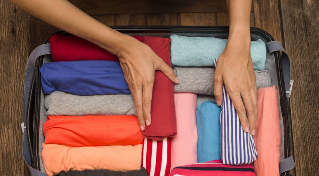how to use packing cubes and plastic bags to save space in your carry on