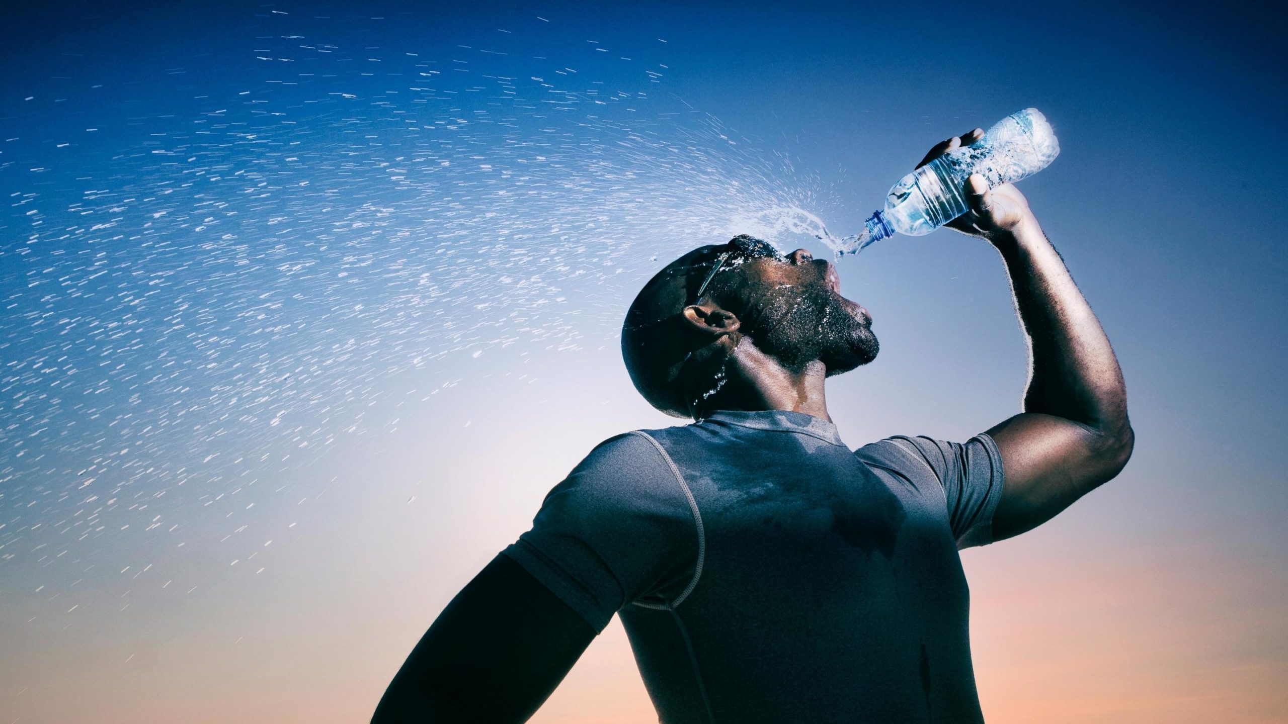 athlete consuming his electrolyte drink