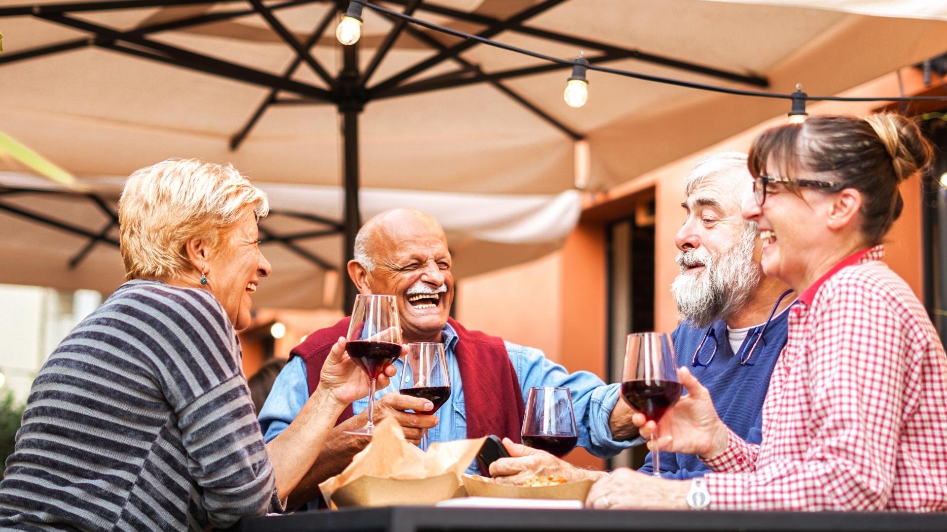 seniors having a good time together over food