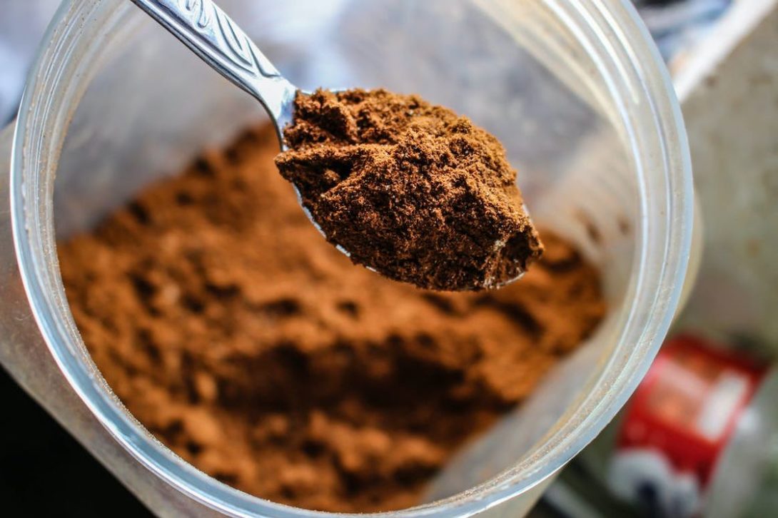 Coffee flavored supplement placed on a tablespoon