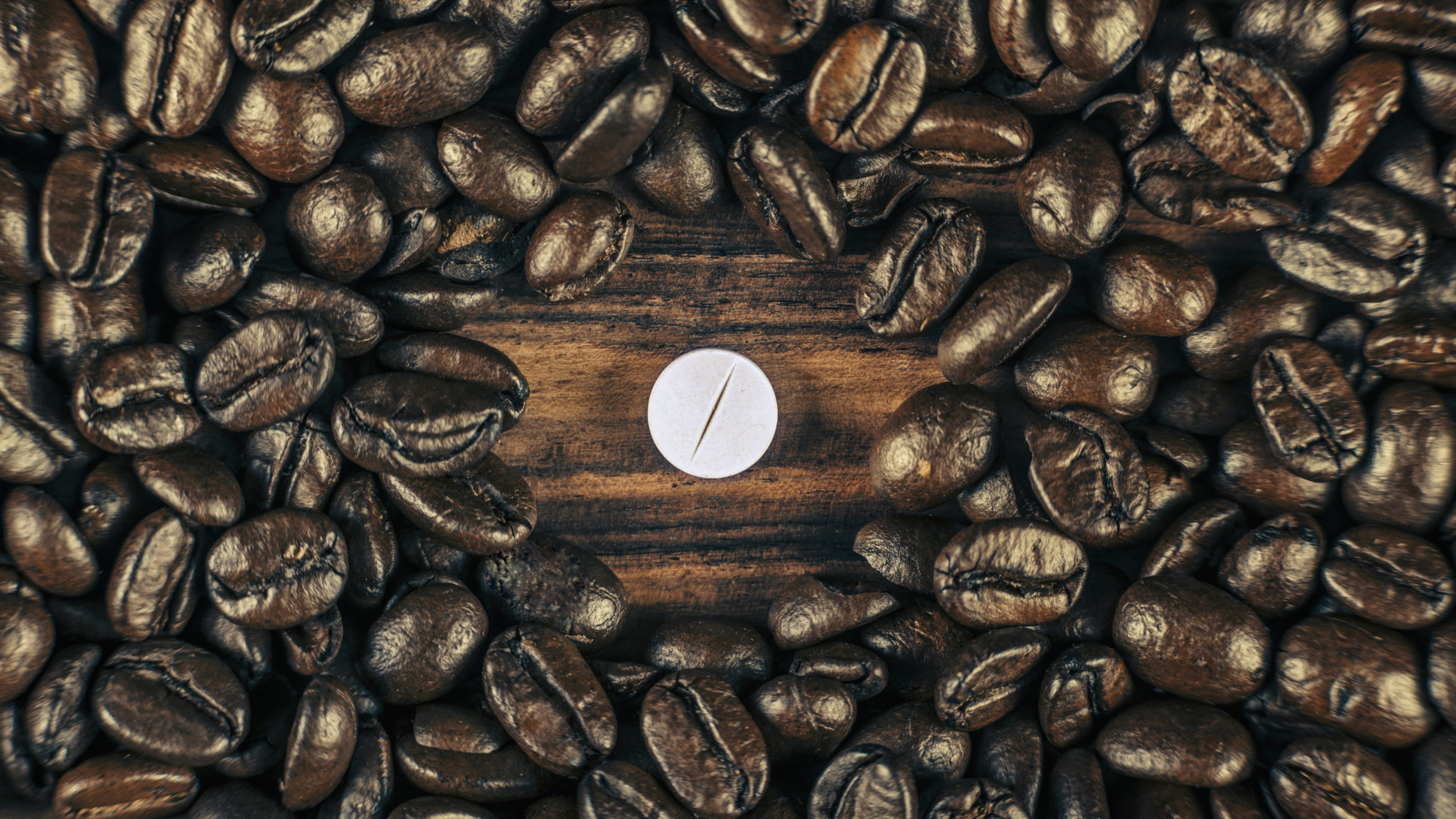 coffee beans and caffeine pill