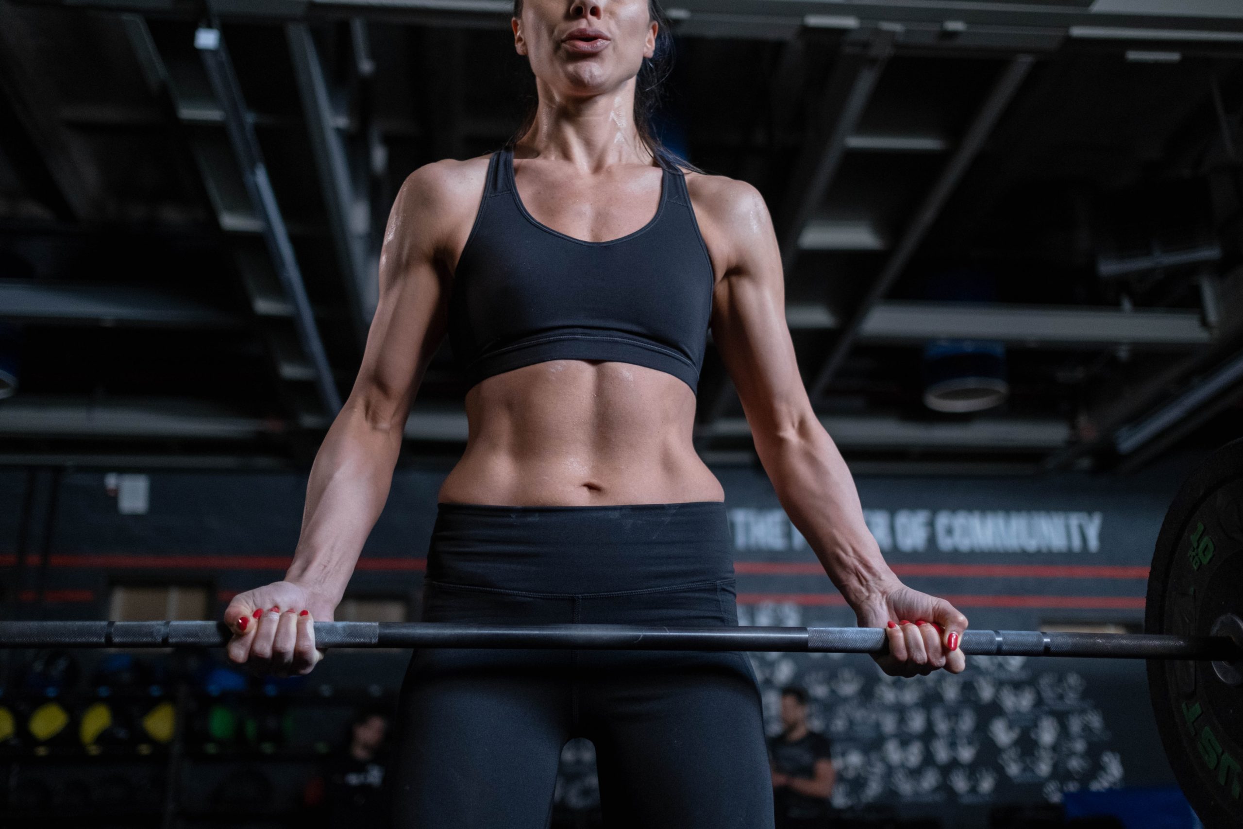 A woman lifting a barbell