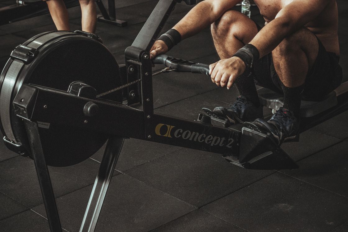 Man using a rowing machine at the gym