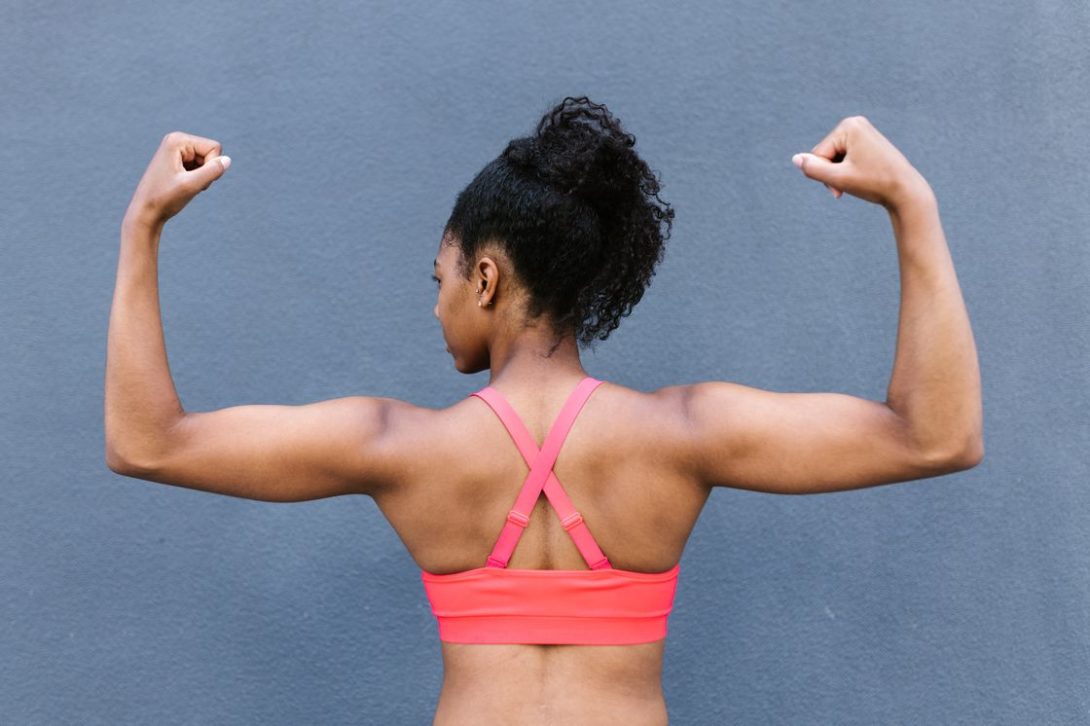 Woman flexing her back muscles