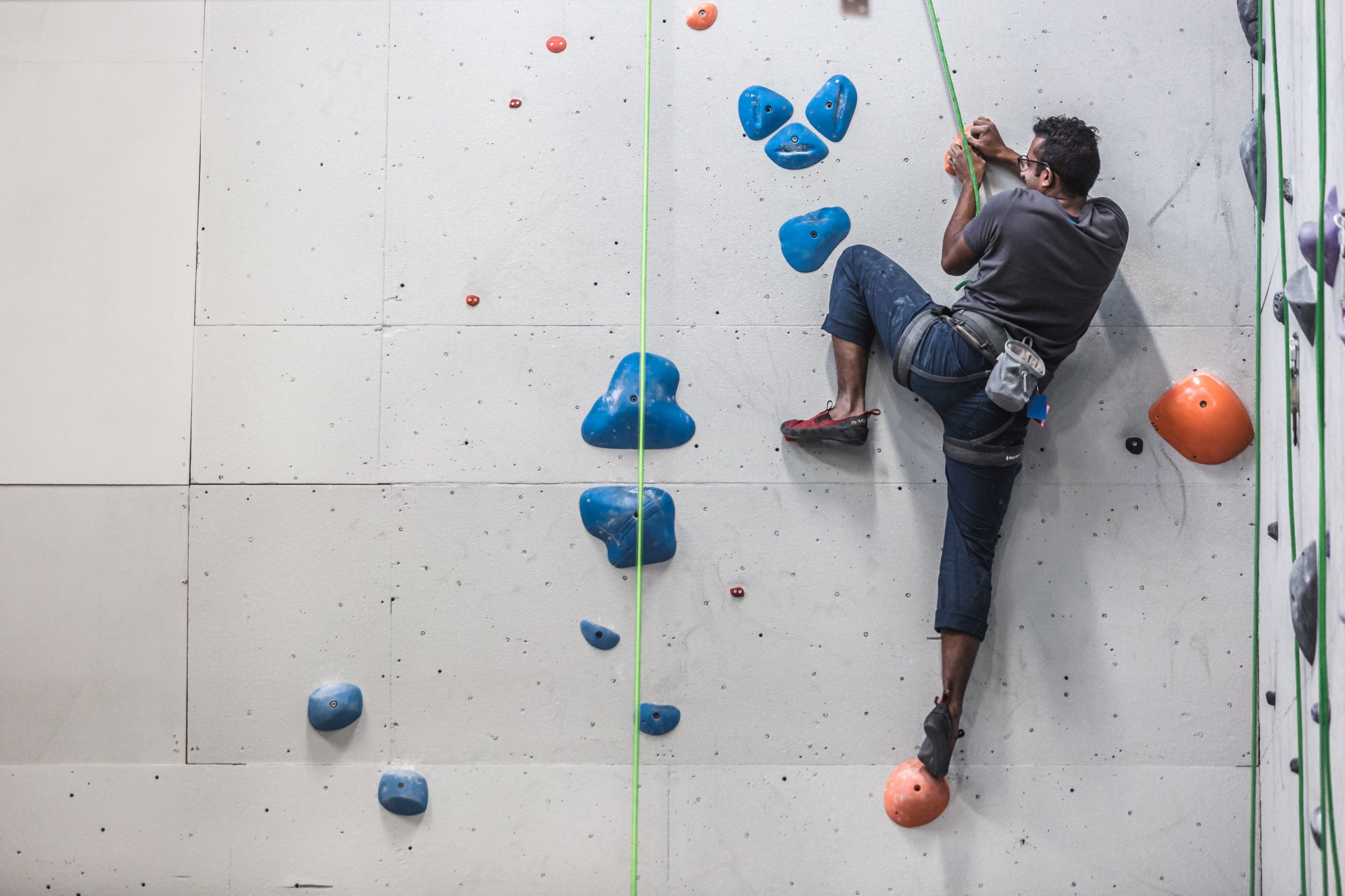 A man climbing indoors