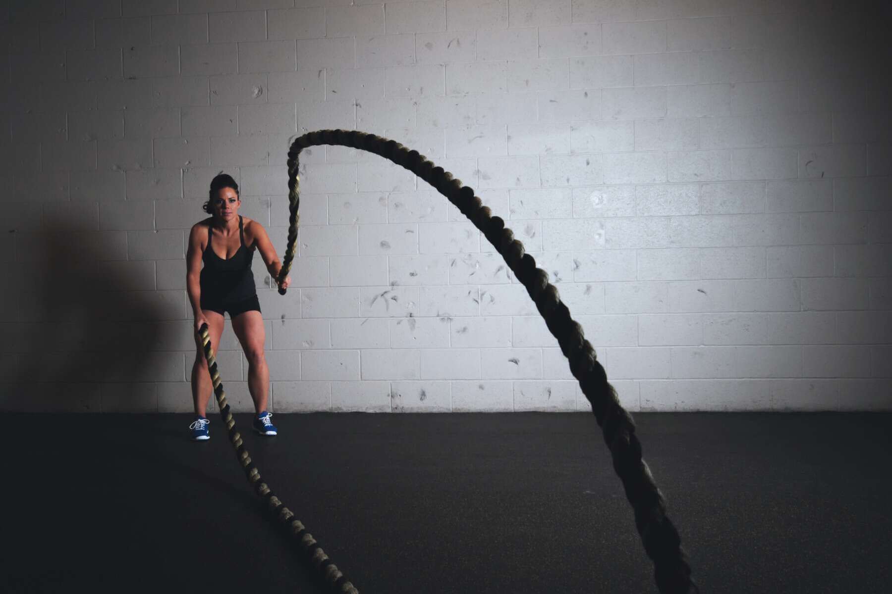 A woman doing a rope workout