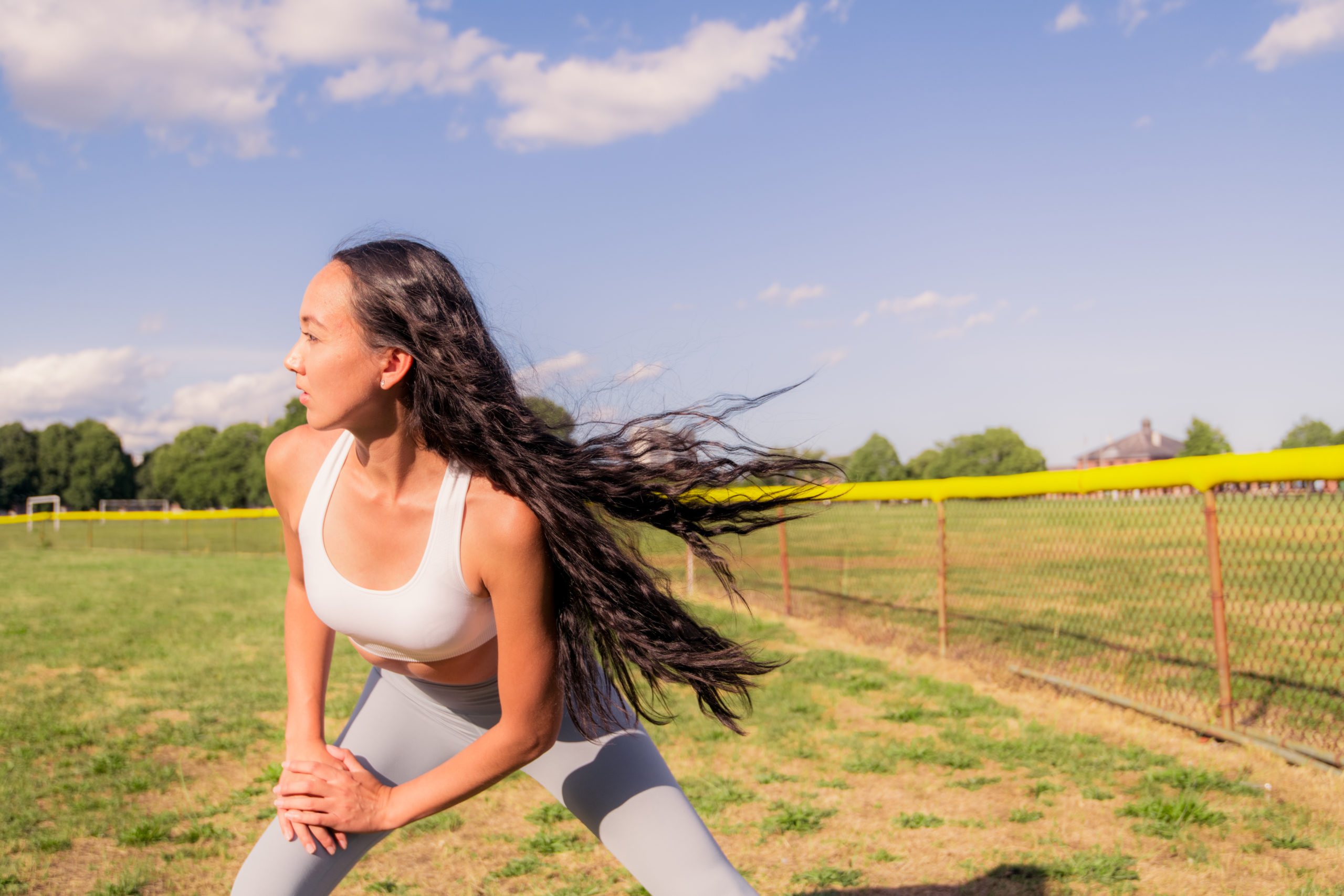 A woman exercising under the sun