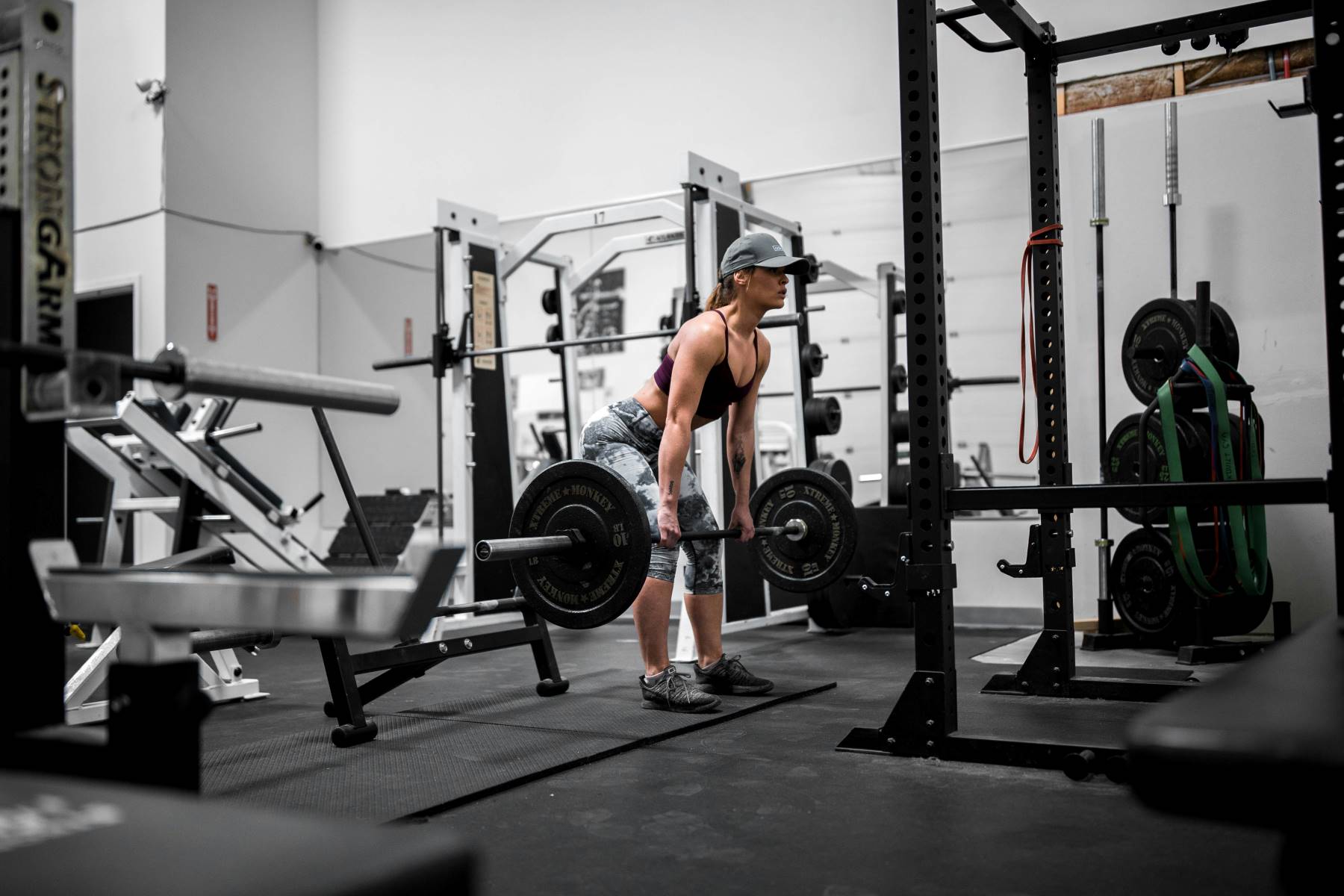 Woman in gym doing deadlift workout