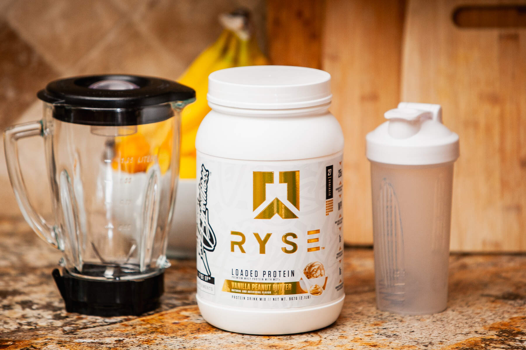 Protein shake preparation on kitchen countertop